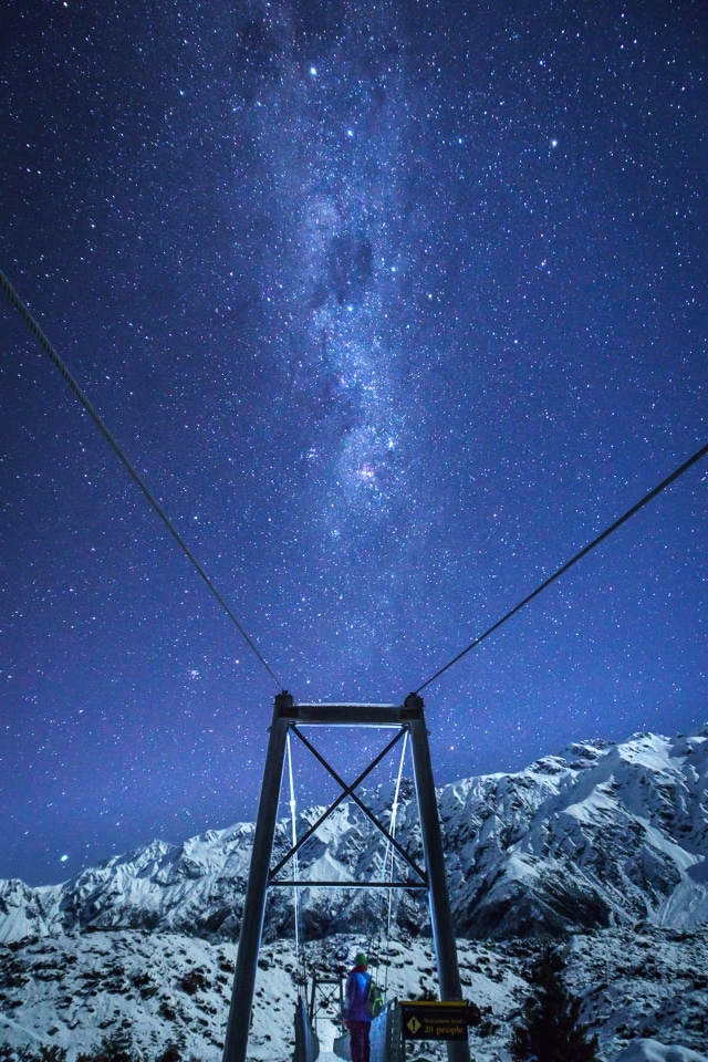 Milky Way over a swing bridge